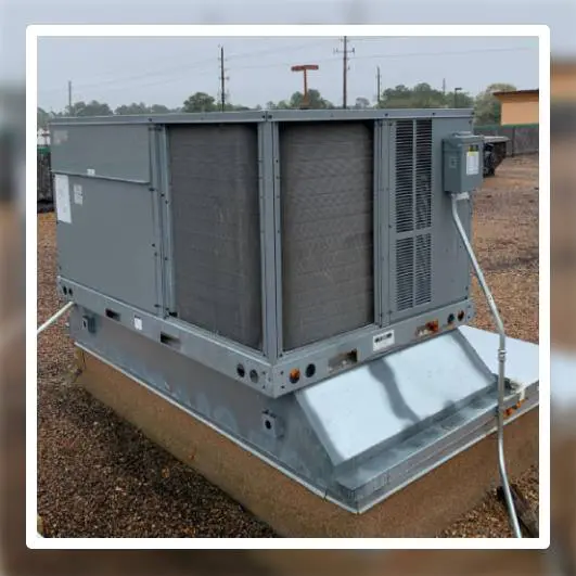 A large air conditioner unit sitting on top of a platform.